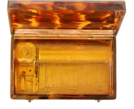 A tortoiseshell musical snuff box playing two airs the Grenadier march and La Caravane du Caire, cylinder 6cm, case 9cm with 