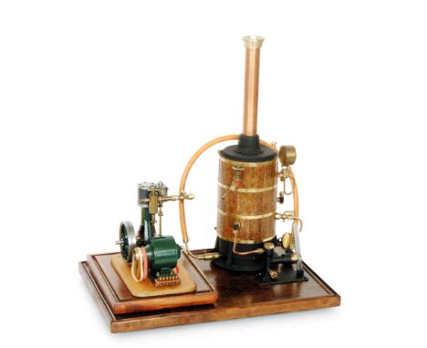 A Stuart vertical steam engine No 10 with dynamo attachment, together with brass banded wooden cylindrical boiler, copper fun