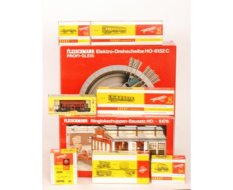 A large quantity of 1960s Fleischmann HO gauge accessories to include rolling stock, rails, transformers and catalogues toget