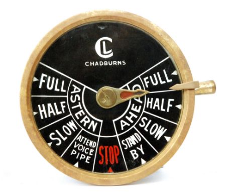 A Chadburns brass engine telegraph with circular dial titled Astern/Ahead, 27cm diameter removed from the ship Vic 99 togethe