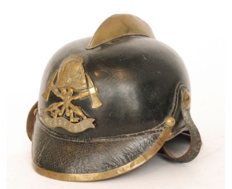 A German firebrigade helmet named Oesselse with brass comb, height 18cm