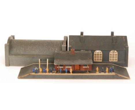 A collection of painted lead railway figures together with a home constructed platform station, an engine shed and tunnel for