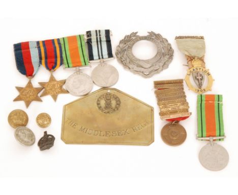 A mine clearance service badge together with two oval enamel SD57 supper badges, a brass Middlesex regiment plate and large c