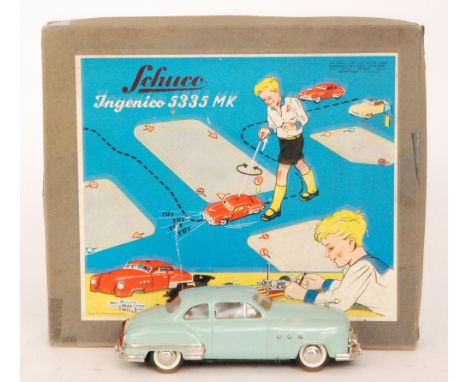 A Schuco Ingenico 5335 MK clockwork saloon car, pale green, in boxed set with tools and control and instruction pamphlet.