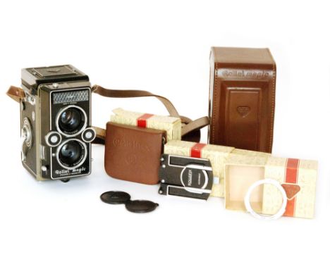 A Rollei Magic 120mm TLR camera in fitted leather case with strap together with various boxed accessories (5)   