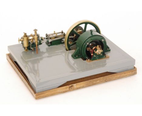 A scratch built horizontal black painted steam engine with single oscillating fly wheel, in glazed case on grey painted base,
