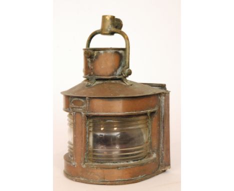 A 20th Century brass rudder indicator by Donkin Ltd Newcastle, width 33cm together with a copper mast head lamp, height 29cm,