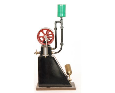 A scratch built model of a vertical steam engine with double oscillating red painted spoked fly wheels, on black wedge shaped