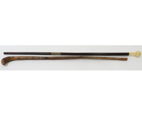 A 19th century rosewood cane, with an ivory knob, together with one other stick 