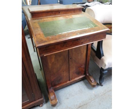 A 19th century walnut davenport, with a green leather insert & double door section 