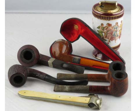 A smoking pipe with silver mounts, in a leather case, along with four other pipes, cigar cutter & a lighter 