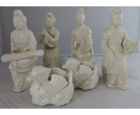 A collection of four Chinese Blanc De Chine figures of seated females, along with two ceramic birds