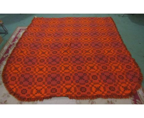 A vintage all wool tapestry bedspread, in orange and brown tones, made in Wales 