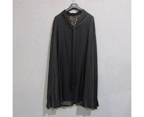An Edwardian black silk evening cloak 