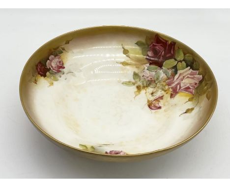 A large Royal Worcester hand painted bowl signed W. Austin decorated with roses and gilt edging - 32cm diameter 