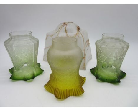 A pair of Victorian Art Nouveau glass lamp shades along with one other and a vintage glass shade