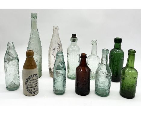 A collection of antique glass bottles including two L. Rose &amp; Co lemonade bottles, Frank Browne, Walker &amp; Sons Ginger