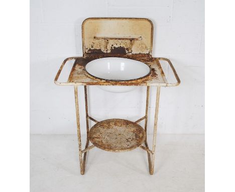 A Continental antique weathered metal washstand with enamel bowl - length 75cm, depth 50cm, height 97cm