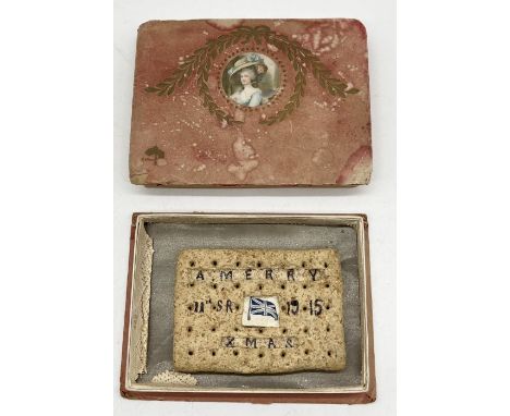 A WW1 army biscuit with the inscription "A Merry Xmas 11th SR 1915" verso "The Great War" with inserted paper union flag