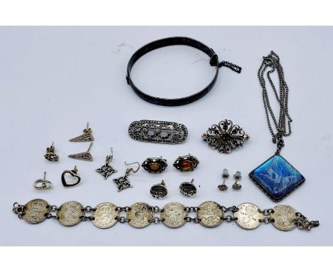 A small collection of silver jewellery including a bangle, pendants etc.