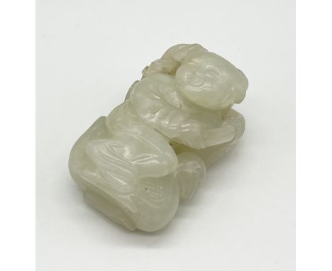 A small carved jade figure of a Deity riding a duck- approx. 5.5cm height