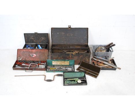 A quantity of various tools contained within metal tool boxes including ratchet/socket sets, various sized spanners etc.