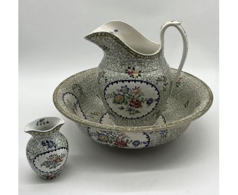 A 19th century Copeland Spode jug and bowl with printed floral design and matching toothbrush holder