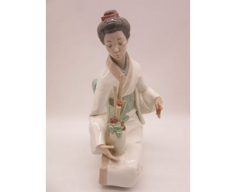 A large Nao figure of kneeling Geisha flower arranging, numbered 1276 height 35cm