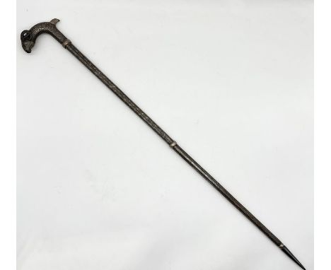 A vintage Islamic walking stick with rams head handle and niello work detail