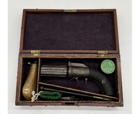 A 19th century pepper box six shot percussion revolver with rotating barrel, engraved side plates and hammer, two piece grip 