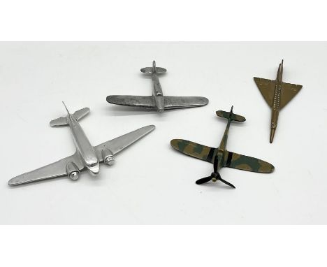 A collection of four model planes including two cast aluminium, brass etc. 