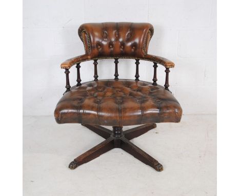 A brown leather Chesterfield style swivel office chair, with button-back detailing - no castors