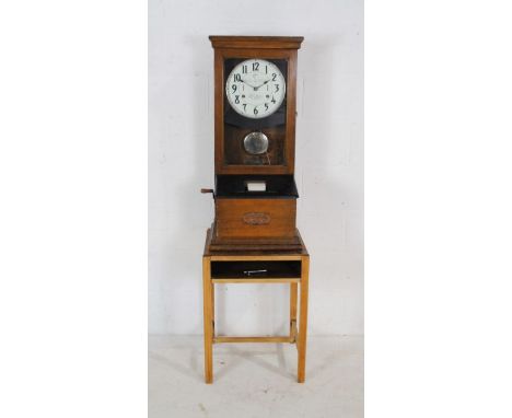 'The International Time Recorder' oak cased clocking in machine, named to 'The Old George, Silsoe' on stand - total dimension