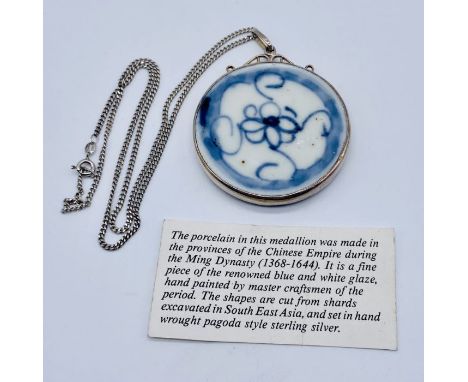 A 925 silver pendant set with a shard of Ming dynasty pottery (5.25cm diameter) on 925 silver chain