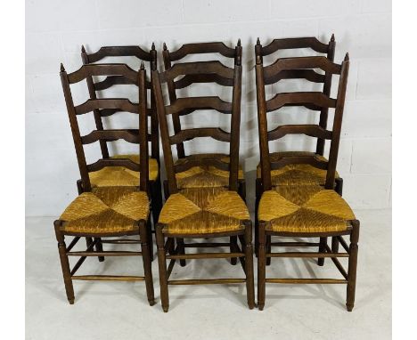 Six French farmhouse ladder back chairs with rush seats.
