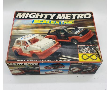 A boxed Mighty Metro Scalextric set including two cars, two controllers, power pack and track.