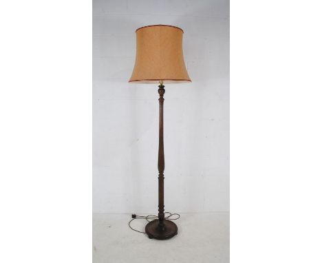 A turned oak standard lamp