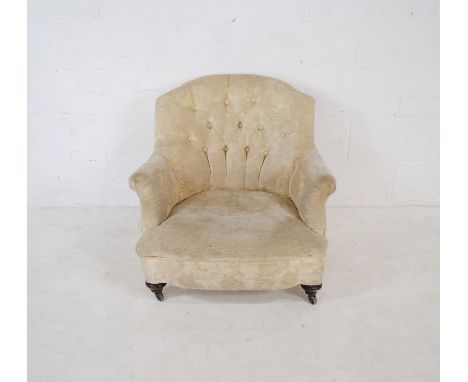 A Victorian button-back armchair - in need of reupholstering