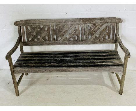 A weathered wooden garden bench 