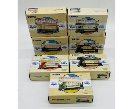 A collection of seven boxed Corgi die-cast model trams including Glasgow Closed Top Tram, South Metropolitan Open Top Tram, D