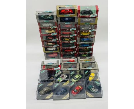 A large collection of boxed Vitesse die-cast model vehicles