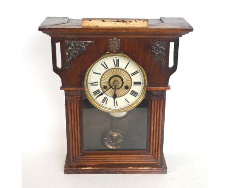VIENNA PINE CASED WALL CLOCK
the shaped glazed door with column decoration opening to reveal a circular dial with a decorativ