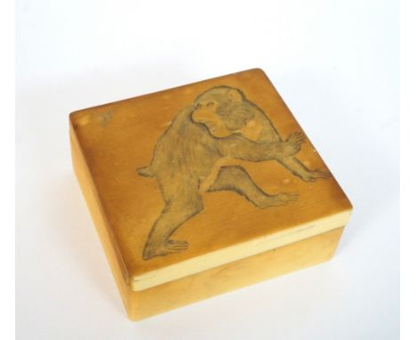 1930's IVORINE SQUARE TRINKET BOX
with a macaque and mosquito to the cover, 9cm wide 