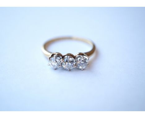 DIAMOND THREE STONE DRESS RING
set in eighteen carat gold, the diamonds totalling approximately 0.65cts, ring size K