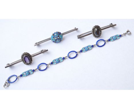 SELECTION OF SILVER JEWELLERY
comprising a blue enamel decorated bar brooch and matching bracelet, a haematite and marcasite 