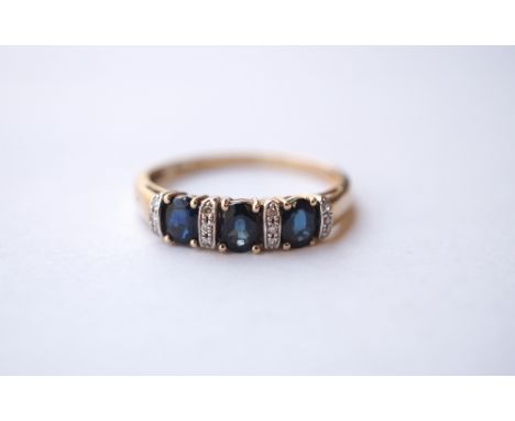 SAPPHIRE AND DIAMOND RING
the three sapphires separated by diamond rows, on nine carat gold shank, ring size R