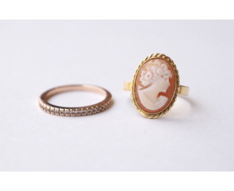 DIAMOND SET HALF ETERNITY RING
in unmarked gold, ring size M; and an Italian cameo set dress ring by Genio e Brevetti, in eig