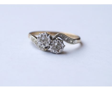 1940's DIAMOND TWO STONE DRESS RING
set in nine carat gold and platinum, ring size L, with original box