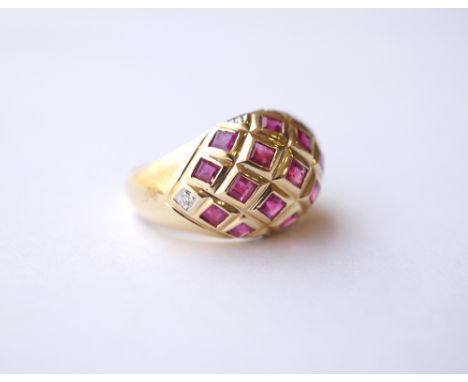 RUBY CLUSTER DRESS RING
the rubies in bombe setting, on eighteen carat gold shank, ring size N