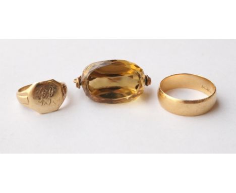 EIGHTEEN CARAT GOLD RING
size N-O, nine carat gold signet ring size G, and a nine carat gold mounted citrine fob (3)